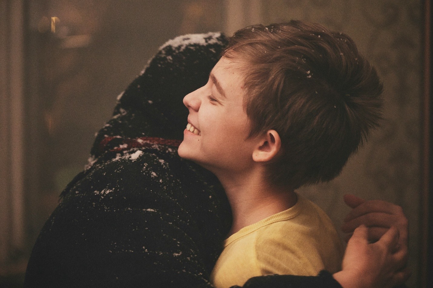 Someone being held in a warm, welcoming embrace