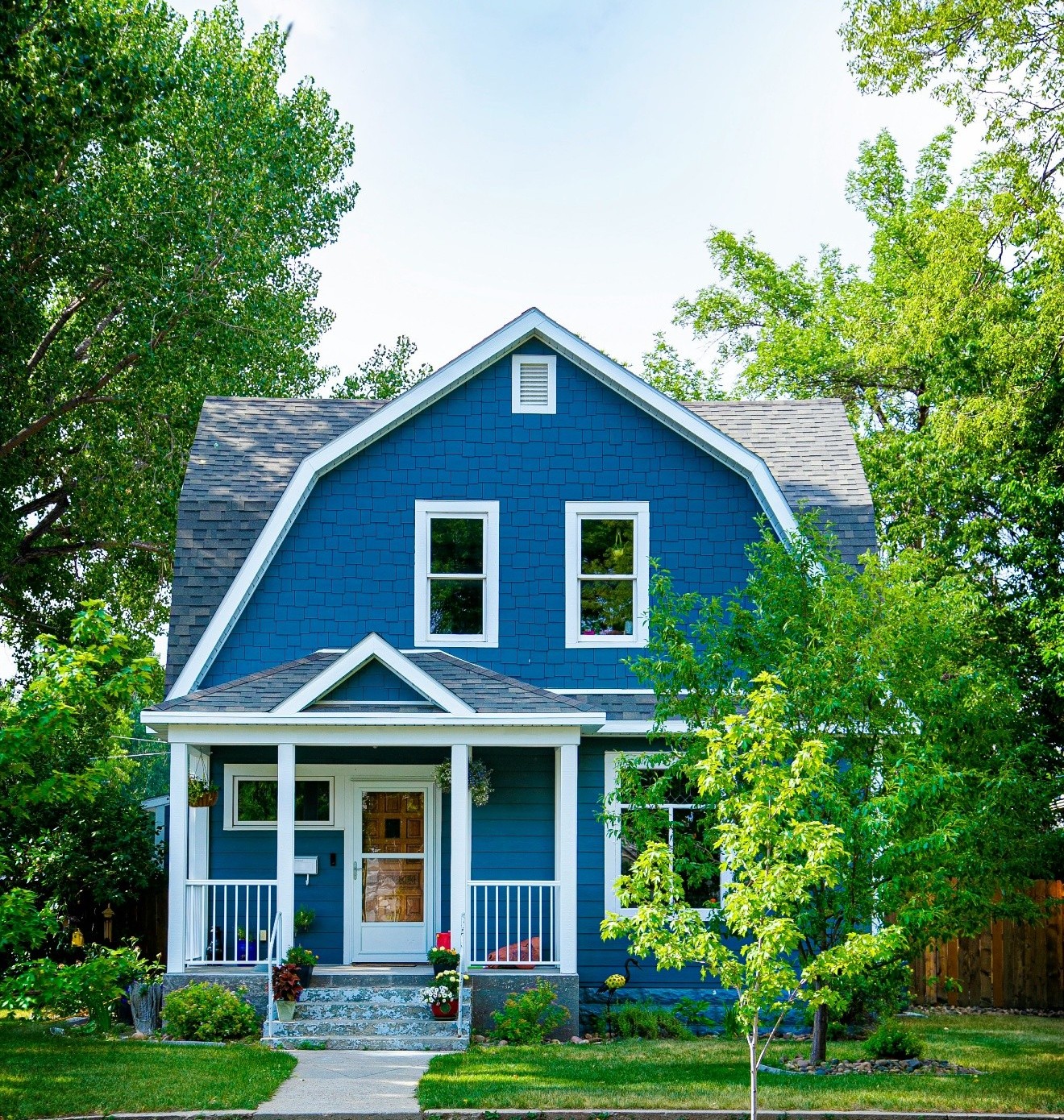 A house with a front porch on a quiet residential street