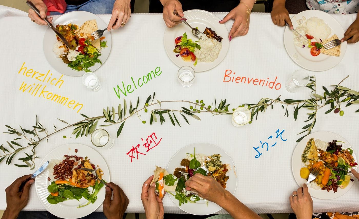 A shared meal in a warm community room